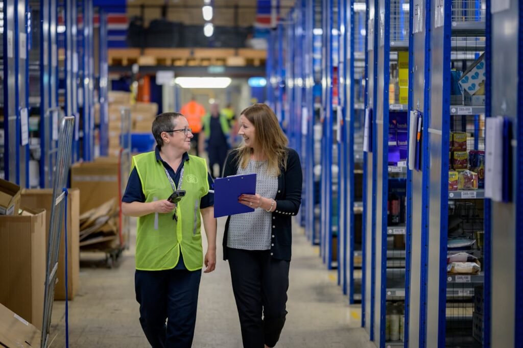 Employees Having a Conversation while Walking Together